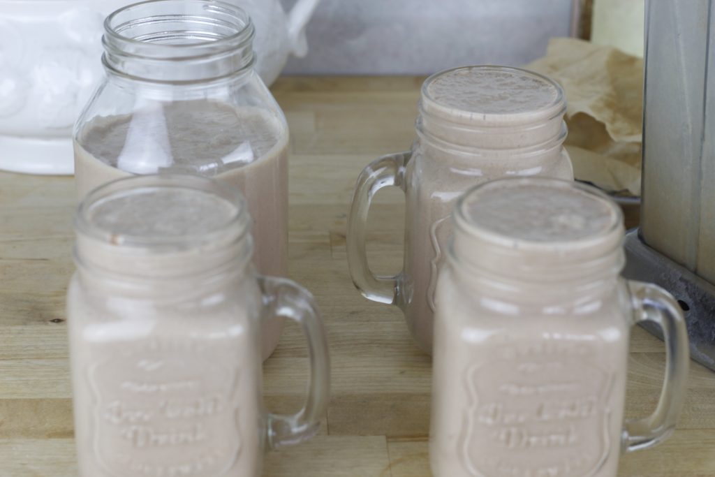image of jars containing Healthy Chocolate kefir smoothie on a countertop