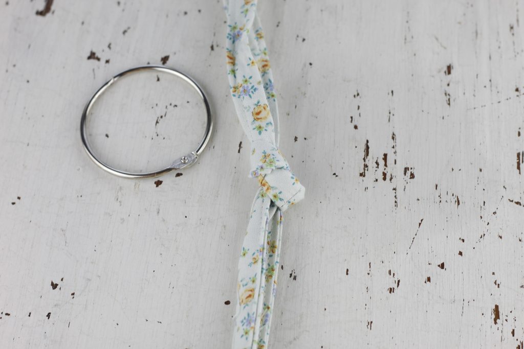 image of metal ring and blue floral fabric strap