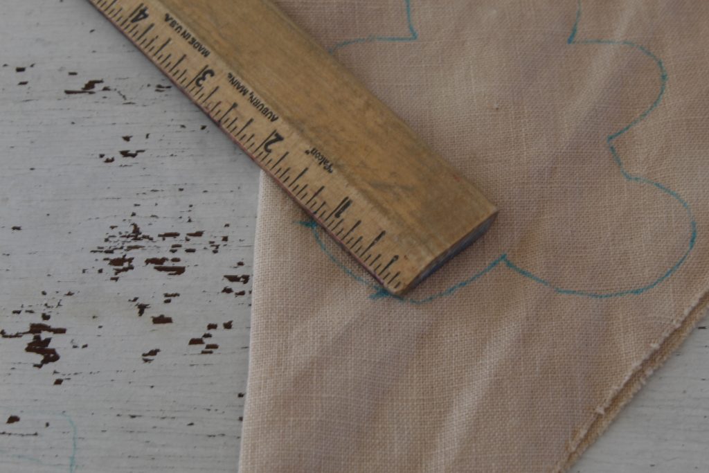 image of ruler measuring marks one inch apart on fabric gingerbread man 