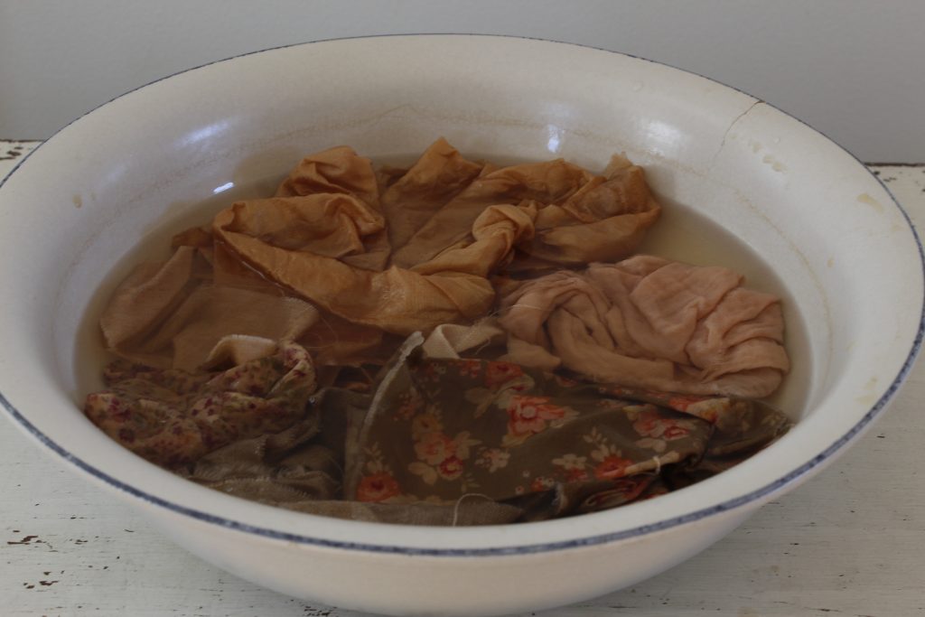 image of fabric in a bowl covered with liquid