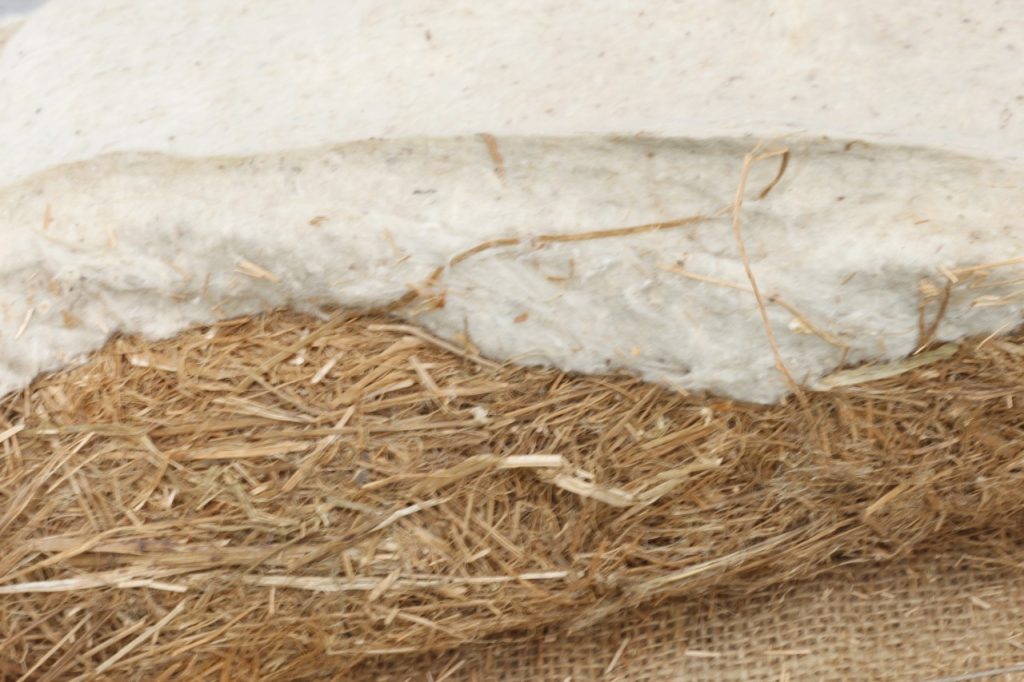 close up image of cotton padding wood wool and burlap 