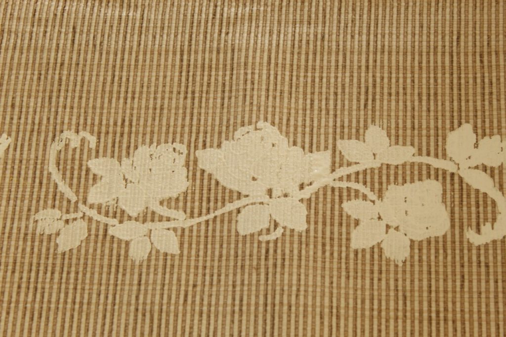 This image shows the result of the painting when the stencil is removed. It is a white border of roses and vine.